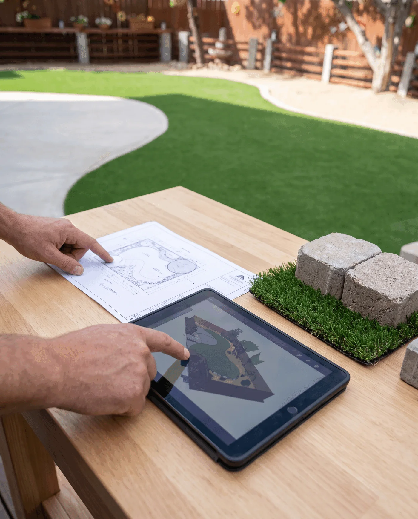 Outdoor-living materials and planning views arranged for an artificial-turf project review