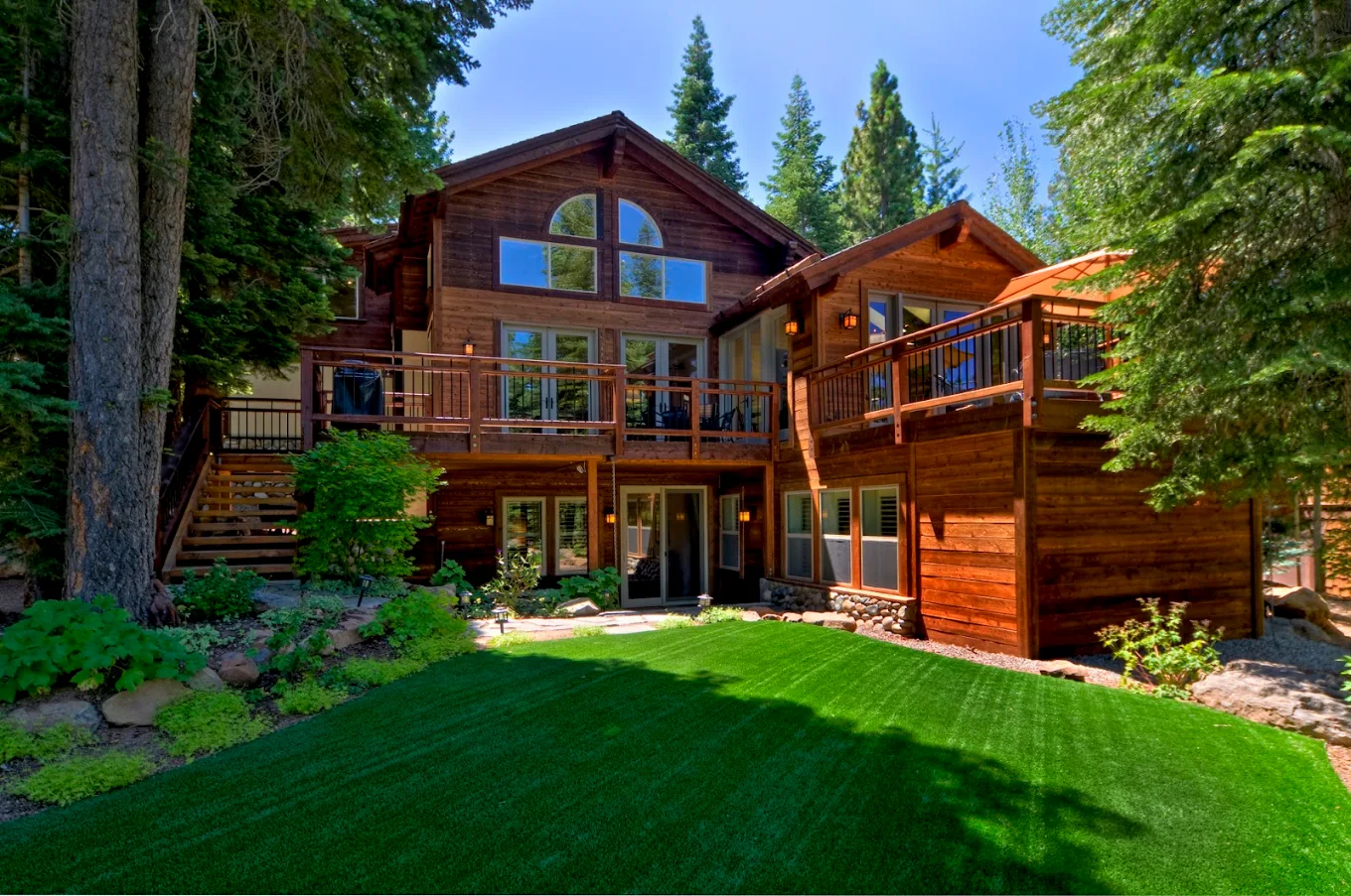 Completed outdoor living space beside a mountain home