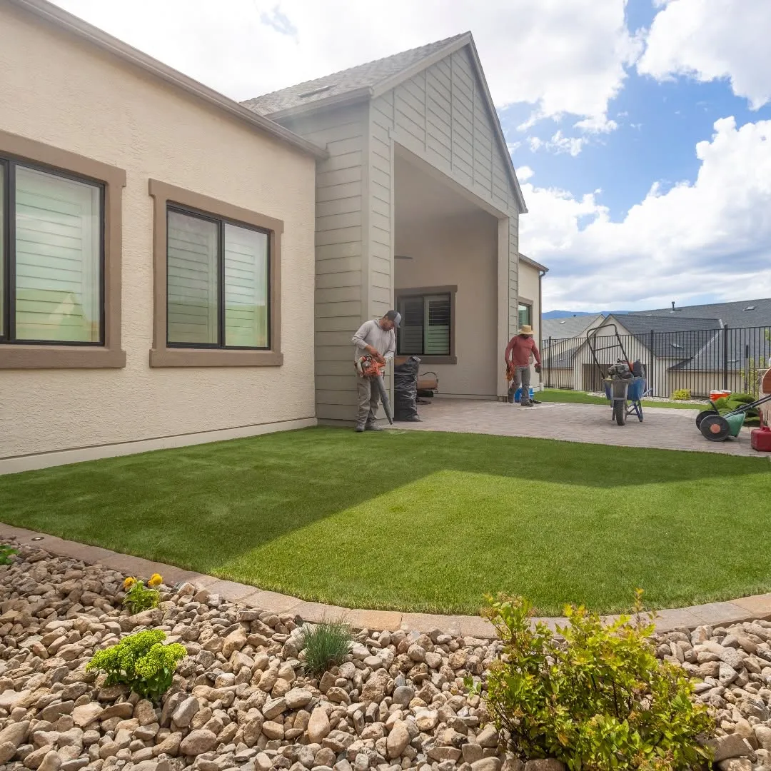 Completed artificial-turf area beside landscaped edging