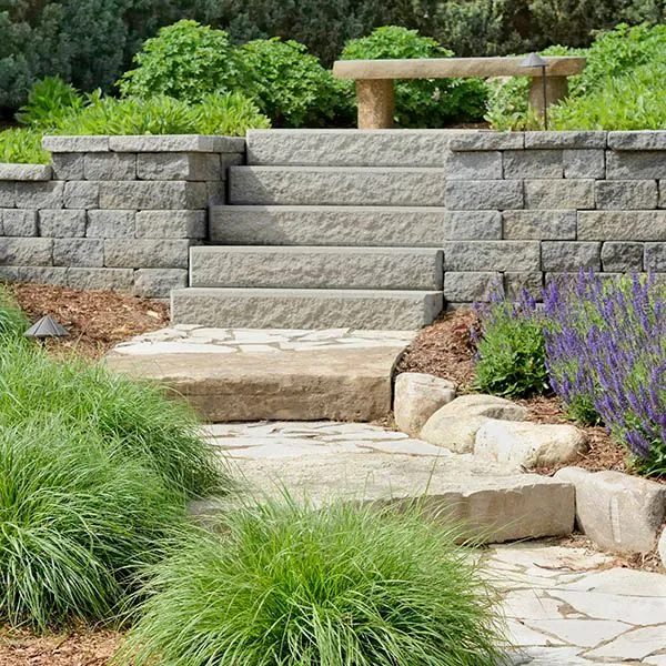 Retaining wall and steps integrated into a planted slope