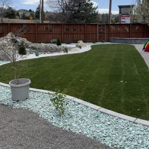 Completed turf area bordered by hardscape and planting