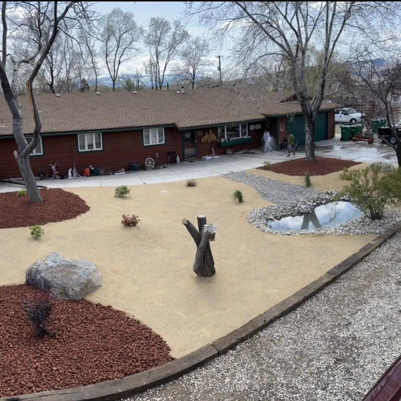 Completed outdoor-living project with hardscape and planted zones