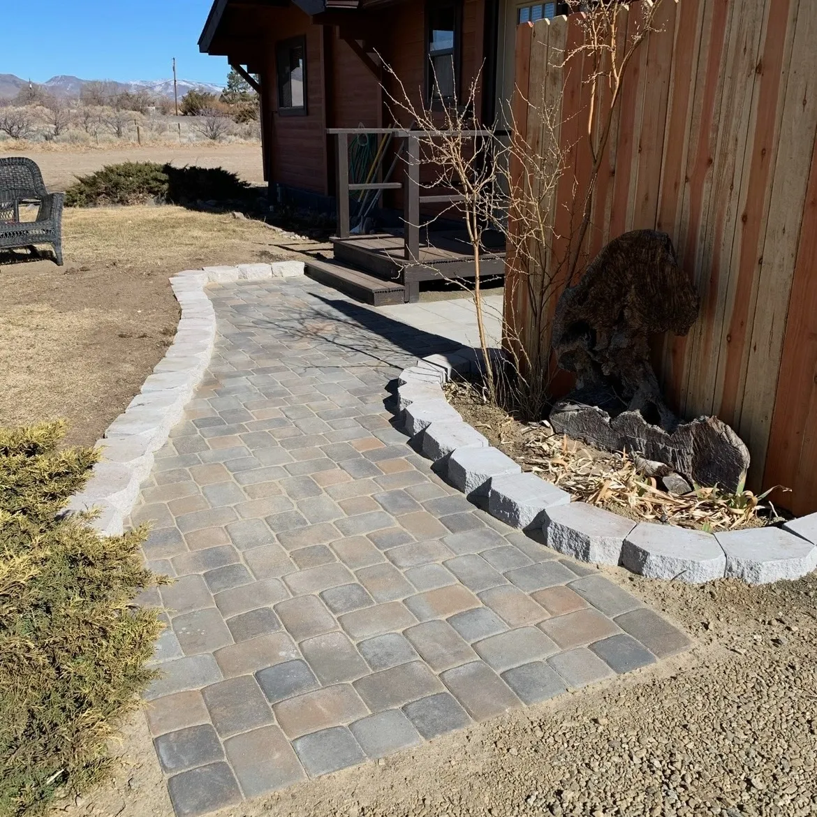 Finished paver area connecting outdoor-use zones